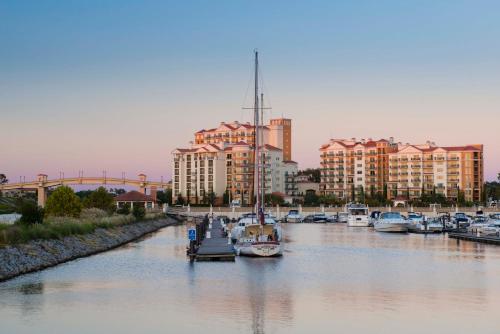 a group of boats docked in a river with buildings at Villas at Marina Inn at Grande Dunes in Myrtle Beach