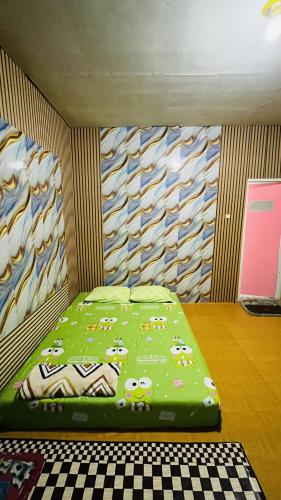 a bedroom with a bed with sheep on it at Bintang Sawarna 2 By ARBA in Sawarna