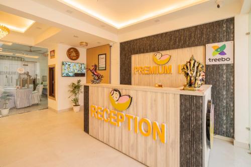 a reception area of a store with a reprogramination sign at Treebo Premium Inn 62 in Noida