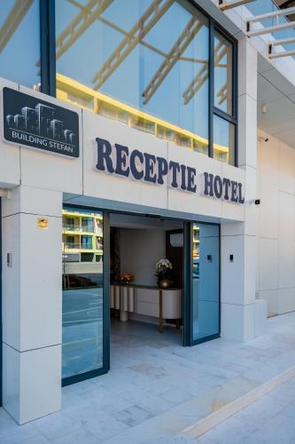 a hotel entrance with a sign that readsreciprocal hotel at Noble Hotel by Building Stefan in Mamaia Sat/Năvodari