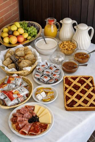 a table with many different types of food on it at Agriturismo Salella in Salento