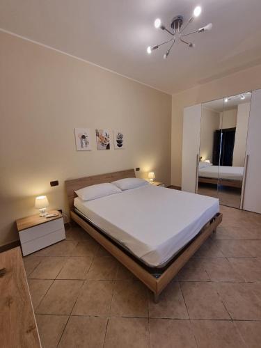 a bedroom with a large bed and a ceiling fan at Villa Sunshine in Balestrate