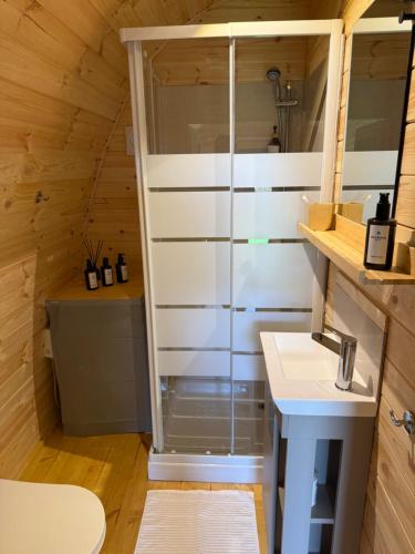 a bathroom with a glass shower in a tiny house at Exotic Sea Boutique Adults Only in Protaras