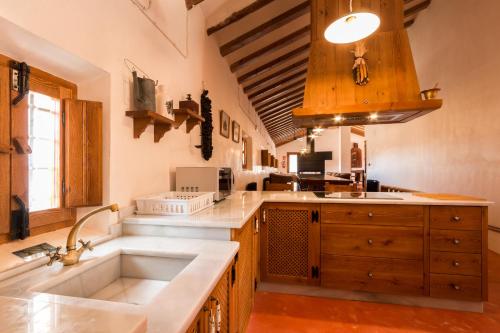 a kitchen with a sink and a counter top at Casa del Labrador in Jumilla