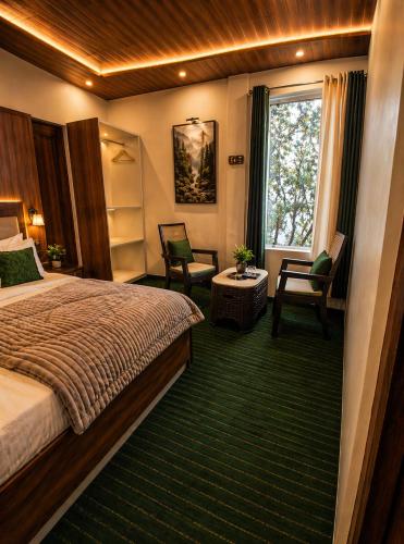 a hotel room with a bed and a window at Tree Heaven Resort-Kanatal in Kanatal