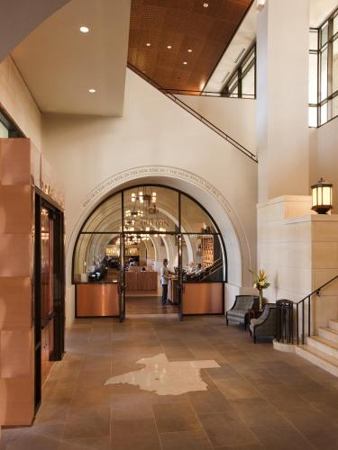 a lobby of a building with a staircase at AT&T Hotel & Conference Center in Austin