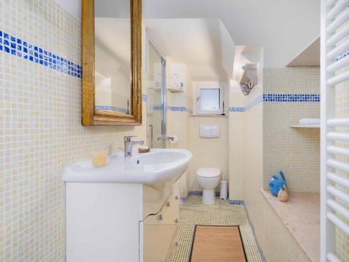 a bathroom with a sink and a toilet at Casa Alberi in Volterra