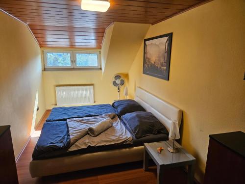 a bedroom with a bed in a small room at Ferienhaus Petzenblick - ganzjährig beheizter und privater Indoorpool in Konovece