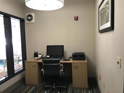 an office with a desk with a computer on it at Country Inn & Suites by Radisson, Dalton, GA in Dalton