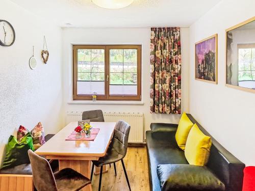 a living room with a table and chairs at Apartment Handle-3 by Interhome in Ried im Oberinntal