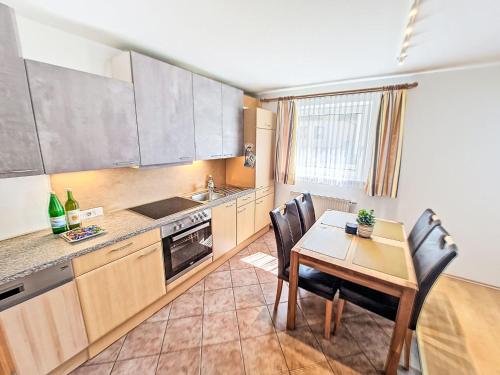 a kitchen with a table and chairs and a dining room at Apartment Christine by Interhome in Prutz