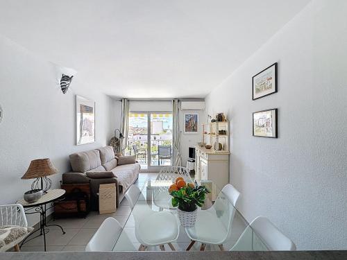 a living room with a couch and a table at Apartment Pattaya-8 by Interhome in Empuriabrava