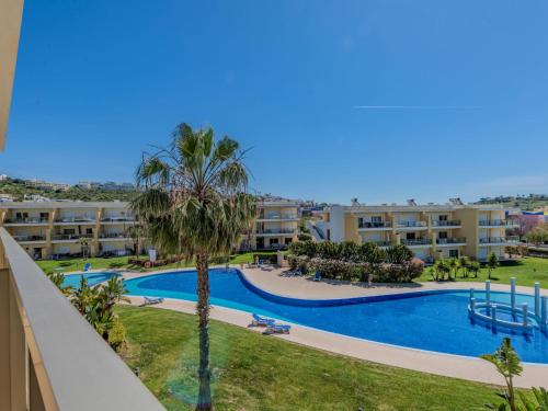 an apartment with a swimming pool and a resort at Apartment Jardins Marina T2 - VIP Properties by Interhome in Albufeira
