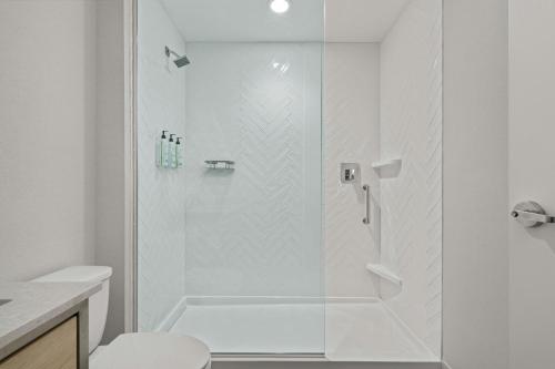 a shower with a glass door in a bathroom at TownePlace Suites by Marriott Murfreesboro in Murfreesboro