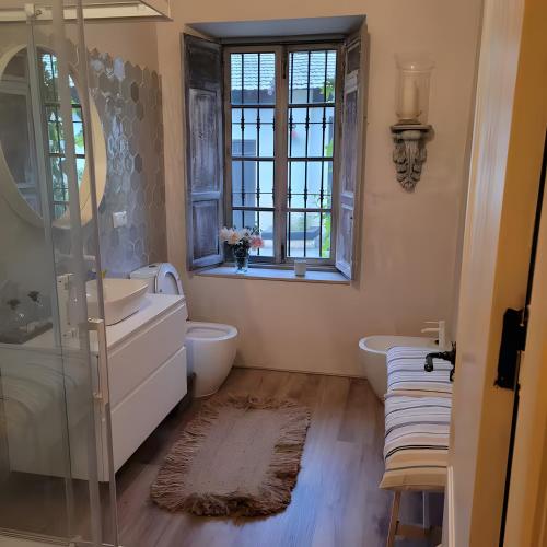 a bathroom with two sinks and a glass shower at El Limonar in Murcia