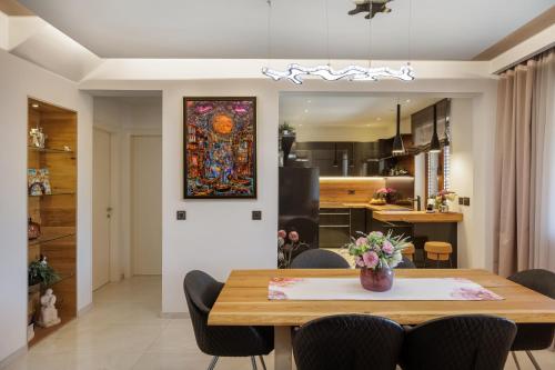 a dining room and kitchen with a table and chairs at Villa Peragro in Dubrovnik