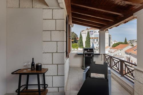 a balcony with a table and a view at Villa Peragro in Dubrovnik
