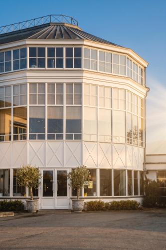 a large building with a lot of windows at Van der Valk Hotel Gent-Drongen in Ghent