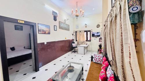 a room with a bedroom with a bed and a mirror at HOTEL SHREE JMM s14 near by in Udaipur