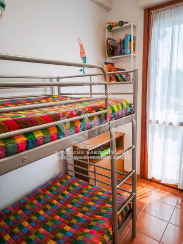 two bunk beds in a room with a colorful blanket at CasAmare in Francavilla al Mare
