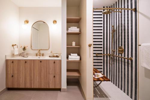 a bathroom with a sink and a mirror at The 27 Wynwood in Miami
