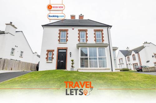 a house with a sign that reads travel lets at Four Bedroom By Travel Lets Holiday Homes Downpatrick With Sea View in Killyleagh
