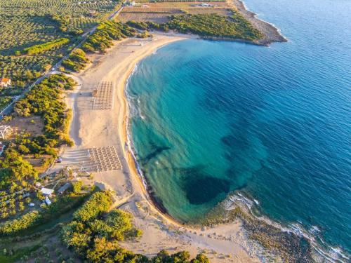 an aerial view of a beach and the ocean at Charming Country House Just Steps from Everything in Kyparissia