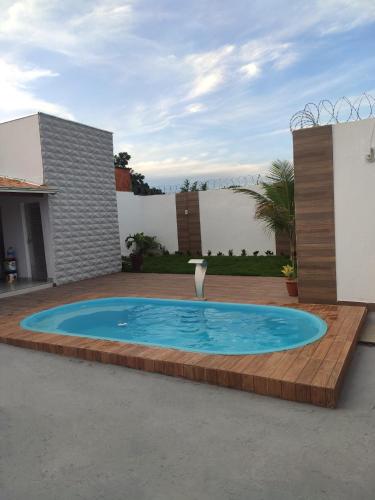 a swimming pool in the middle of a yard at Casa Oliveira in Montes Claros