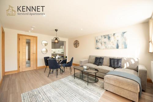 a living room with a couch and a table at Hazel Lodge in Reading