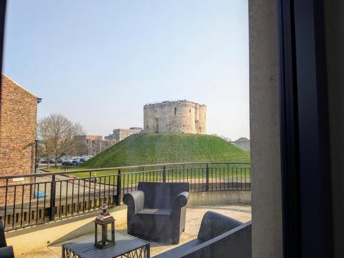 a view of a castle from a balcony at The Old Fire Station Luxury Apartment in York