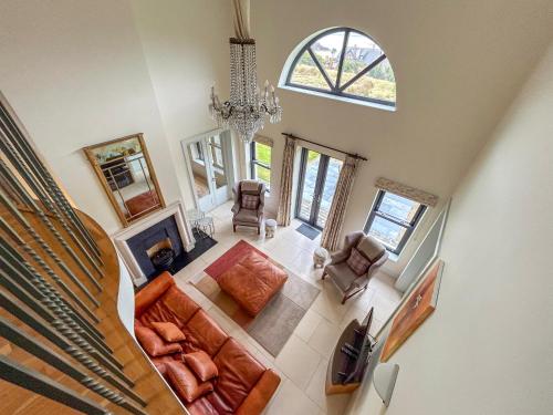 an overhead view of a living room with a chandelier at Country Setting in the Middle of Dingle Town. in Dingle