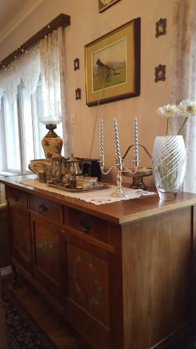 a wooden counter with a vase on top of it at Sovica in Bled