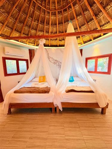 Cama ou camas em um quarto em Cabanas Jaalkab