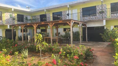 an outside view of a building with a deck at Hotel centro de Pedernales in Pedernales