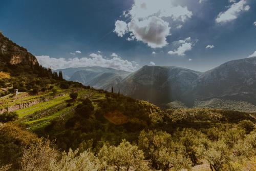 a view of a valley with mountains and trees at Boutique Hotel Skamnos Arachova in Arachova
