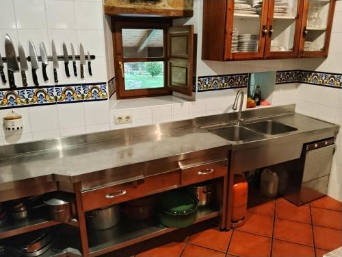 a kitchen with a sink and a counter at Río da Cruz in Cariño