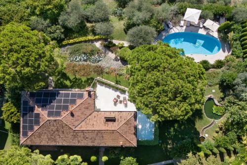 an overhead view of a house with solar panels on the roof at Villa Rosa del Garda Golf and Bike in Garda
