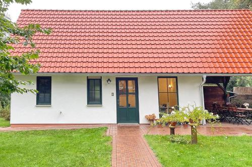 a white house with an orange roof at Eichengrund Baum 7 in Burg