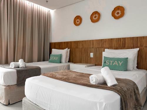 two beds in a hotel room with two at STAY Cosmopolitan in Palmas