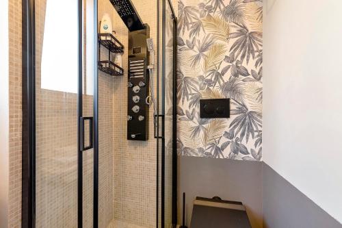 a shower in a bathroom with a tile wall at Dimora Camponobile - Turi in Turi