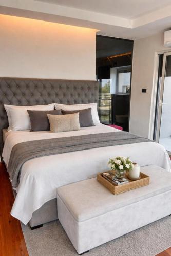 a large bedroom with a large bed with a table at Kuća za odmor ANTON in Blato