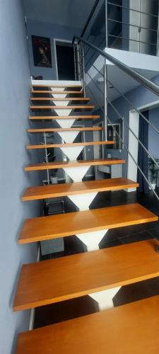 a staircase in a building with wooden steps at KasaNova in Rabo de Peixe