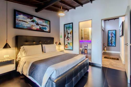 a bedroom with a large bed in a room at Viktory Boutique Hotel in Medellín
