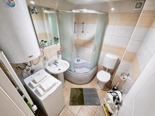 a small bathroom with a toilet and a sink at ZVEZDA LUX in Kruševac