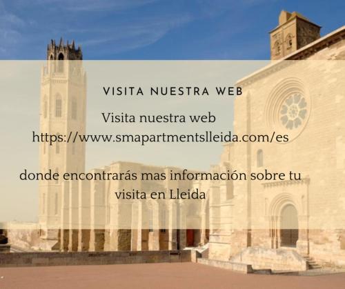 a view of a church with a sign on the side of it at SM Apartments in Lleida
