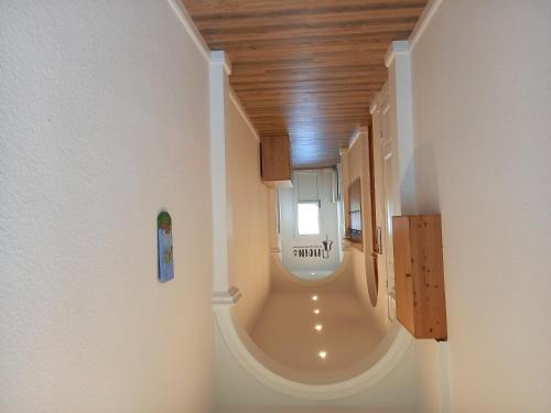 a bathroom with a toilet in the middle of a room at Ulfershausen in Wangerland