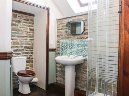 a bathroom with a sink and a toilet at The Granary in Bucknell