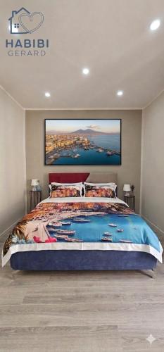 a bedroom with a large bed with a picture on the wall at Habibi Gerard in Torre del Greco