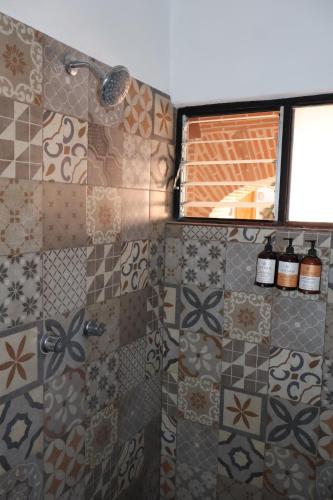 a bathroom with a shower and a window at Hotel Casa de Vino in Tequisquiapan