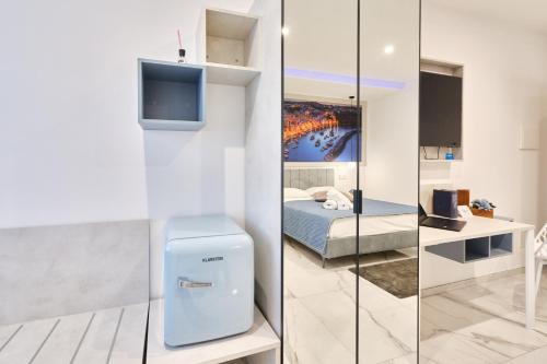 a bedroom with a bed and a tv in a room at Hotel America in Scafati